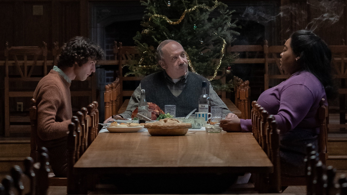 A scene from The Holdovers. Paul, Angus and Mary are having Christmas dinner.